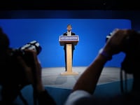 Britain's Prime Minister Rishi Sunak addresses delegates at the annual Conservative Party Conference in Manchester on October 4, 2023.