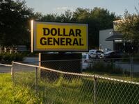 Police investigators continue to work at a Dollar General store a day after a white man armed with a high-powered rifle and a handgun killed three Black people before shooting himself