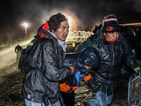 articles/2016/11/21/standing-rock-police-attack-protesters-again-he-just-smiled-and-shot-both-my-kneecaps/161121-white-standing--rock-tease_sz66xq