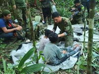 Rescuers shown with the missing children