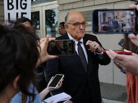 Former New York City Mayor Rudy Giuliani, an attorney for former President Donald Trump during challenges to the 2020 election results, exits U.S. District Court after attending a hearing in a defamation suit.