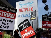 Striking WGA (Writers Guild of America) members picket with striking SAG-AFTRA members outside Netflix studios