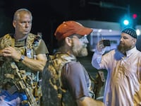 articles/2015/08/11/cops-knew-militia-was-coming-to-ferguson/150811-glawe-oath-keeper-tease_cbzcpv