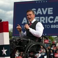Madison Cawthorn speaks before a rally for Donald Trump