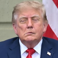 Donald Trump and first lady Melania Trump look on during a ceremony commemorating the 25th anniversary of the September 11th terrorist attacks in the courtyard of the Pentagon on September 11, 2026 in Arlington, Virginia.