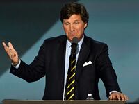 Milwaukee , Wisconsin - July 18: Tucker Carlson speaks at Fiserv Forum on July 18, 2024, on the final day of the Republican National Convention in downtown Milwaukee, Wis. Former President Donald Trump is set to be named the Republican presidential nominee during the RNC after he was injured by a bullet in an assassination attempt on July 13 during a campaign rally in Butler, Pa.