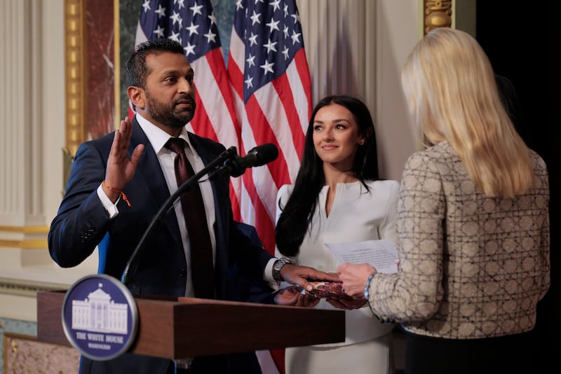 WASHINGTON, DC - FEBRUARY 21: U.S. Attorney General Pam Bondi swears in the new Federal Bureau of Investigation Director Kash Patel as his girlfriend Alexis Wilkins holds the Bhagavad Gita in the Indian Treaty Room in the Eisenhower Executive Office Building on February 21, 2025 in Washington, DC. Patel was confirmed by the Senate 51-49, with Sen. Susan Collins (R-ME) and Sen. Lisa Murkowski (R-AK) the only Republicans voting to oppose him. Patel has been a hard-line critic of the FBI, the nation’s most powerful law enforcement agency. (Photo by Chip Somodevilla/Getty Images)