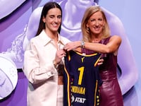 Caitlin Clark poses with WNBA Commissioner Cathy Engelbert after being selected first overall pick by the Indiana Fever during the 2024 WNBA Draft at Brooklyn Academy of Music on April 15, 2024 in New York City.