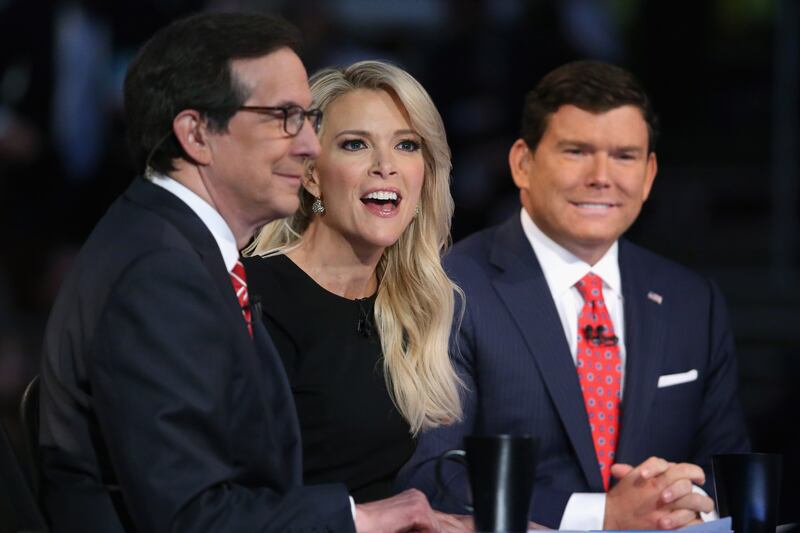 CLEVELAND, OH - AUGUST 06: FOX News anchors (L-R) Chris Wallace, Megyn Kelly and Bret Baier moderate the first prime-time Republican presidential debate hosted at the Quicken Loans Arena August 6, 2015 in Cleveland, Ohio. The top-ten GOP candidates were selected to participate in the debate based on their rank in an average of the five most recent national political polls. (Photo by Chip Somodevilla/Getty Images)