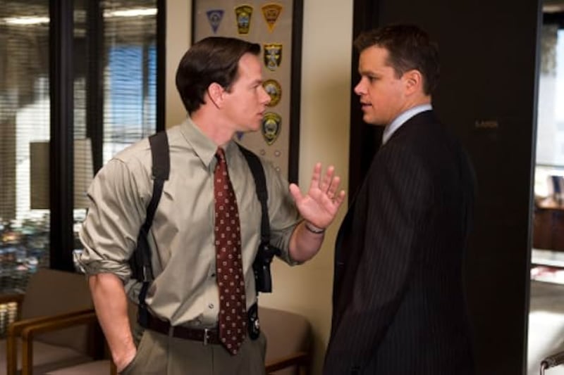 Matt Damon and his apparent lookalike, Mark Wahlberg, appear side by side in a scene from ‘The Departed.’