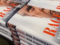 Copies of Bob Woodward’s 2020 book ‘Rage,’ featuring Donald J. Trump on the cover