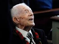 Jimmy Carter leaves the funeral service of his wife.