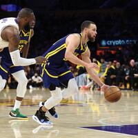Stephen Curry #30 of the Golden State Warriors dribbles past the defense of LeBron James #23 of the Los Angeles Lakers during the second half of a game at Crypto.com Arena on March 16, 2024 in Los Angeles, California.