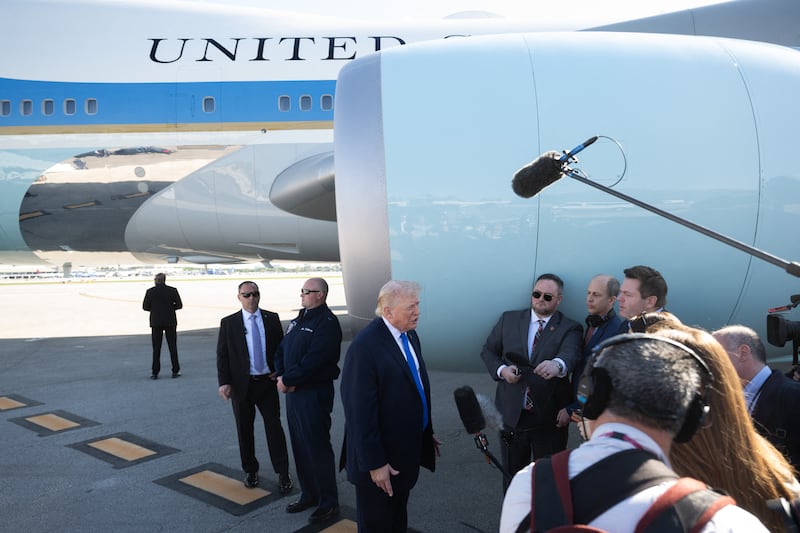 US President Donald Trump speaks to reporters before boarding Air Force One at Palm Beach International Airport in West Palm Beach, Florida, on March 23, 2026. President Donald Trump said Monday that there are "major points of agreement" in US-Iran talks which he said must result in Tehran giving up its nuclear ambitions and enriched uranium stockpile. Trump said the talks -- which Iran denies are taking place -- were being conducted with a "top person" but not the country's supreme leader. (Photo by SAUL LOEB / AFP via Getty Images)