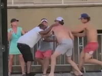 Three white men jump a Black man on a boat deck in Montgomery, Alabama.
