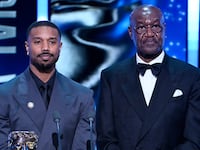 Michael B. Jordan and Delroy Lindo present the Special Visual Effects Award on stage during the EE BAFTA Film Awards 2026 at The Royal Festival Hall on February 22, 2026 in London, England.