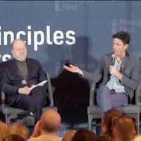 Colorado Governor Jared Polis and conservative political strategist Tim Miller of The Bulwark speak at the Principles First Summit on February 23, 2025.