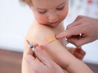 Bonn, Germany - February 19: In this photo illustration a child was getting a vaccination on February 19, 2021 in Bonn, Germany. (Photo by Ute Grabowsky/Photothek via Getty Images)