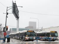 Chicago Transit Authority (CTA) warming buses sit at the migrant landing zone during a winter storm on January 12, 2024 in Chicago, Illinois.