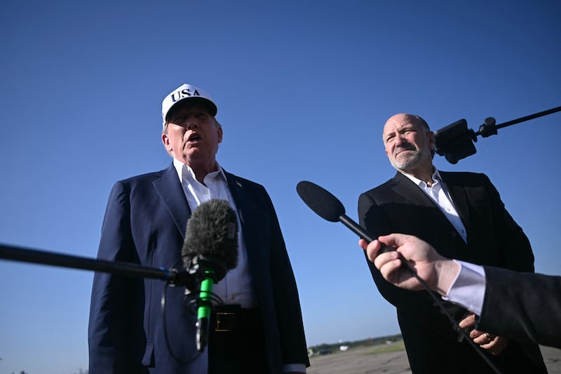 President Donald Trump standing alongside Commerce Secretary Howard Lutnick on July 6, 2025, insisted that cuts to staffing at the National Weather Service did not have an impact on the deadly flooding in Texas as officials there said they did not know what was coming before the disaster.