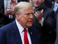 Donald Trump walks with his mouth open outside a New York City courthouse.