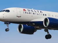 Delta Air Lines Airbus A220-100 aircraft as seen on final approach landing with landing gear down at New York JFK John F. Kennedy International Airport on 14 November 2019 in New York, US. The airplane has the registration N121DU, 2x PW jet engines. The renamed Airbus A220 airliner was Bombardier CS100, BD-500-1A10. Delta Air Lines DL Delta is the largest airline carrier in the world with a hub in New York-JFK. (Photo by Nicolas Economou/NurPhoto via Getty Images)