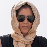 Homeland Security Secretary Kristi Noem rides a camel to a tour of Qal'at al-Bahrain Fort in Bahrain.