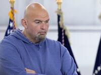 U.S. Senator John Fetterman (D-PA) listens as U.S. President Joe Biden addresses the Interstate 95 bridge collapse