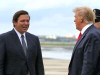 Ron DeSantis greets Donald Trump at Orlando International Airport in June 2019.