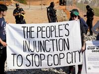 People protest at the site of the Atlanta police training center, derisively called "Cop City"