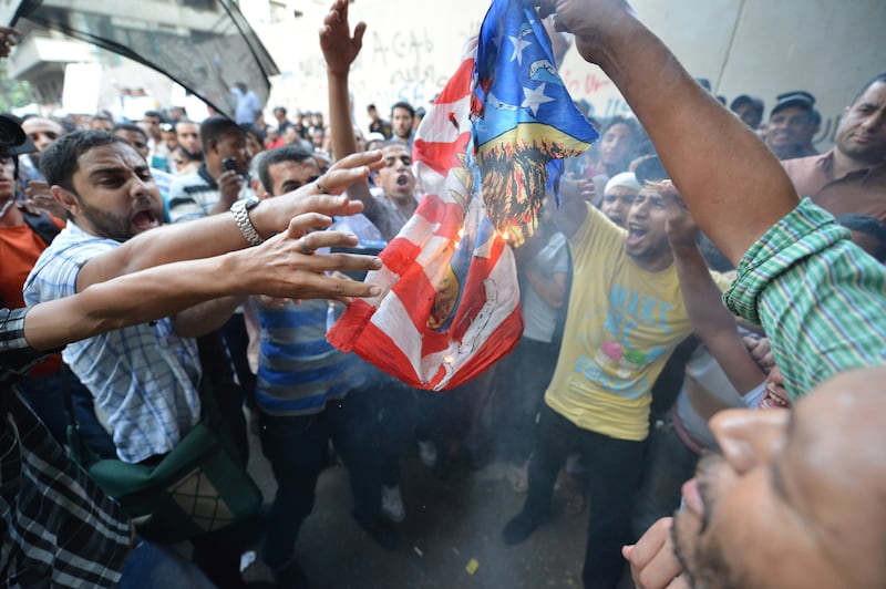 articles/2012/09/13/did-obama-err-in-tolerating-egypt-s-intolerant-muslim-brotherhood/egypt-burning-flag_pmhdzh
