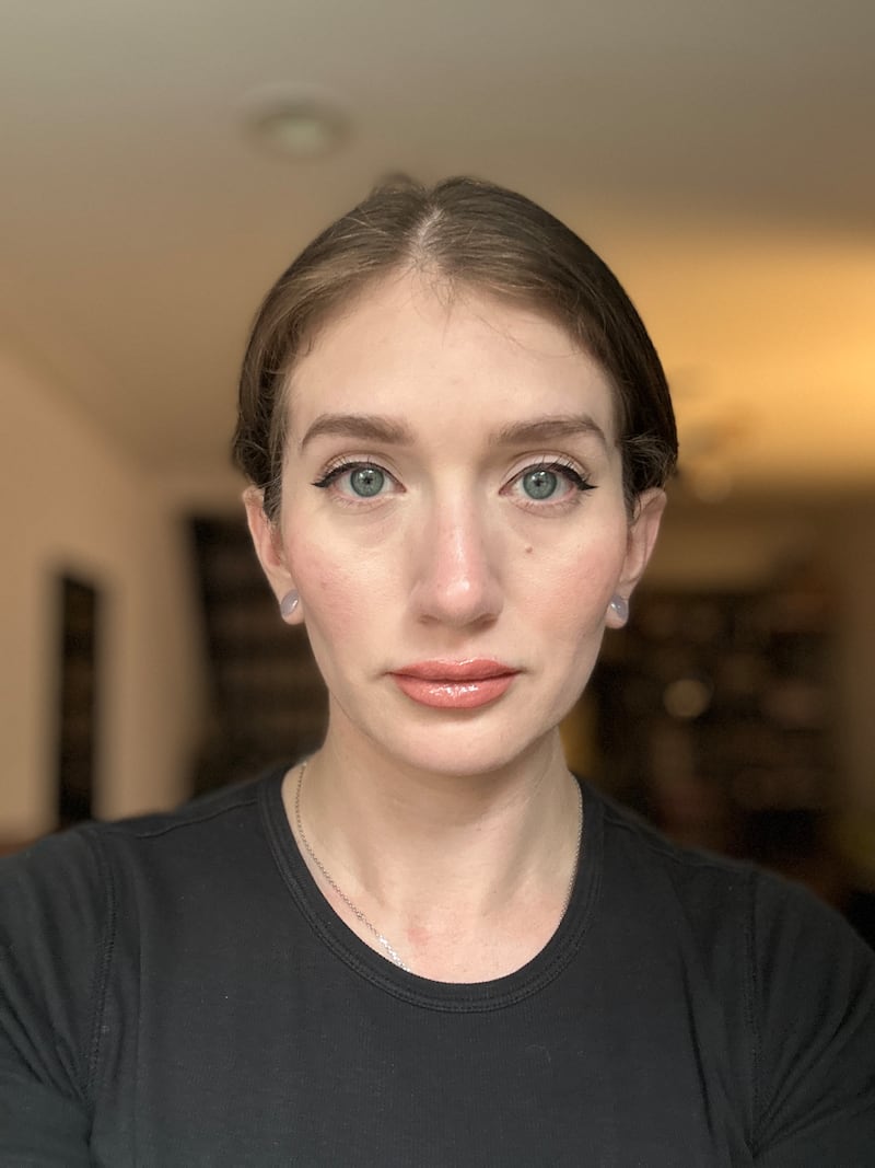 a selfie of editor Sam Escobar from The Daily Beast wearing Trader Joe's Facial Sunscreen