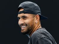Nick Kyrgios of Australia laughs during a practice session on court 16 at Melbourne Park in Melbourne, Victoria, Australia, Jan. 15, 2023.