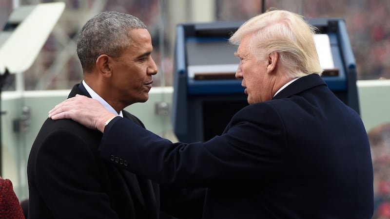 Barack Obama shake hands with Donald Trump