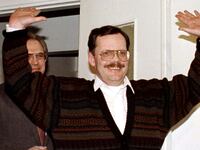 Terry Anderson celebrates with his hands raised after he was freed from being a hostage in Lebanon.