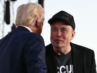 Tesla CEO Elon Musk (R) joins former US President and Republican presidential candidate Donald Trump during a campaign rally at site of his first assassination attempt in Butler, Pennsylvania on October 5, 2024.