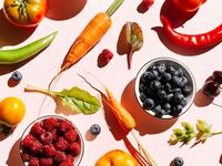 Pattern of variety fresh of organic berry fruits and vegetables and healthy vegan meal ingredients on pink background. Concept of food, vegetable, agriculture, harvest, food producer and healthy and vegetarian food.. Flat lay, top view