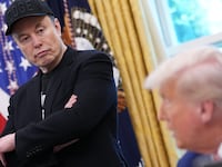 WASHINGTON, DC - MAY 30: Tesla CEO Elon Musk listens as U.S. President Donald Trump speaks to reporters in the Oval Office of the White House on May 30, 2025 in Washington, DC. Musk, who served as an adviser to Trump and led the Department of Government Efficiency, announced he would leave his role the Trump administration to refocus on his businesses. (Photo by Kevin Dietsch/Getty Images)