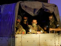 Wagner mercenaries pull out of the headquarters of the Southern Military District to return to base, in the city of Rostov-on-Don, Russia, June 24, 2023.