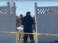 Authorities at the scene where a body was found in a freezer at a home in Headland, Alabama.