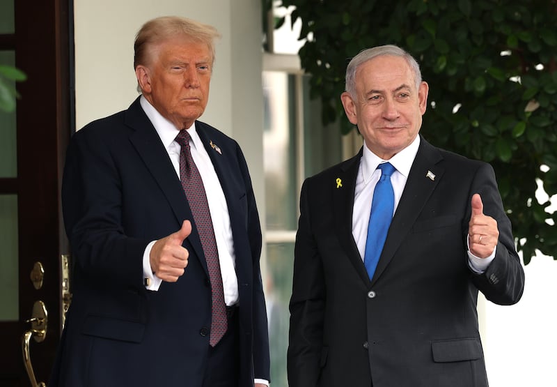 Donald Trump (L) greets Israeli Prime Minister Benjamin Netanyahu as he arrives at the White House on September 29, 2025 in Washington, DC..