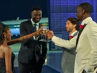 Photo still of Charity Lawson, Dotun, Joey, and Xavier toasting champagne in 'The Bachelorette'