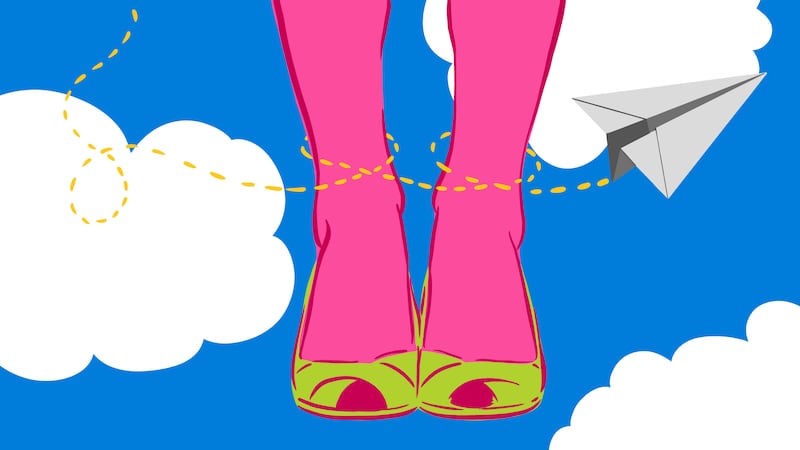 Woman's leg in front of clouds with a paper airplane flying around
