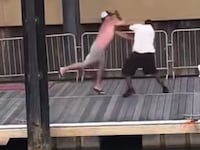 Screenshot of video footage showing the beginning of a big brawl on a dock in Alabama.