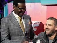 NFL Network reporter Michael Irvin speaks with Philadelphia Eagles head coach Nick Sirianni during Super Bowl Opening Night at Footprint Center.