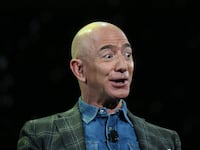 Jeff Bezos addresses the audience during a keynote session at the Amazon Re:MARS conference on robotics and artificial intelligence at the Aria Hotel in Las Vegas, Nevada on June 6, 2019.