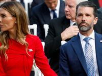 Donald Trump Jr. (R) sits with his girlfriend Bettina Anderson.