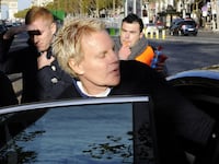 Mike Jeffries, CEO of US clothing retailer Abercrombie & Fitch leaves the store on the Champs Elysees avenue in Paris