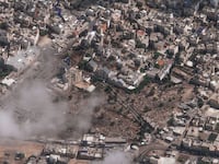 A photo including an overview of Al Ahli Hospital after explosion