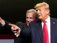 Kevin McCarthy (R-CA) and President Donald Trump react to the crowd as they hold an event on water accessibility for farms during a visit to Bakersfield, California, Feb. 19, 2020.